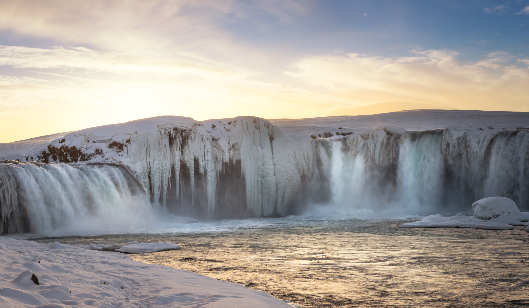 Setting sun behind the cascade